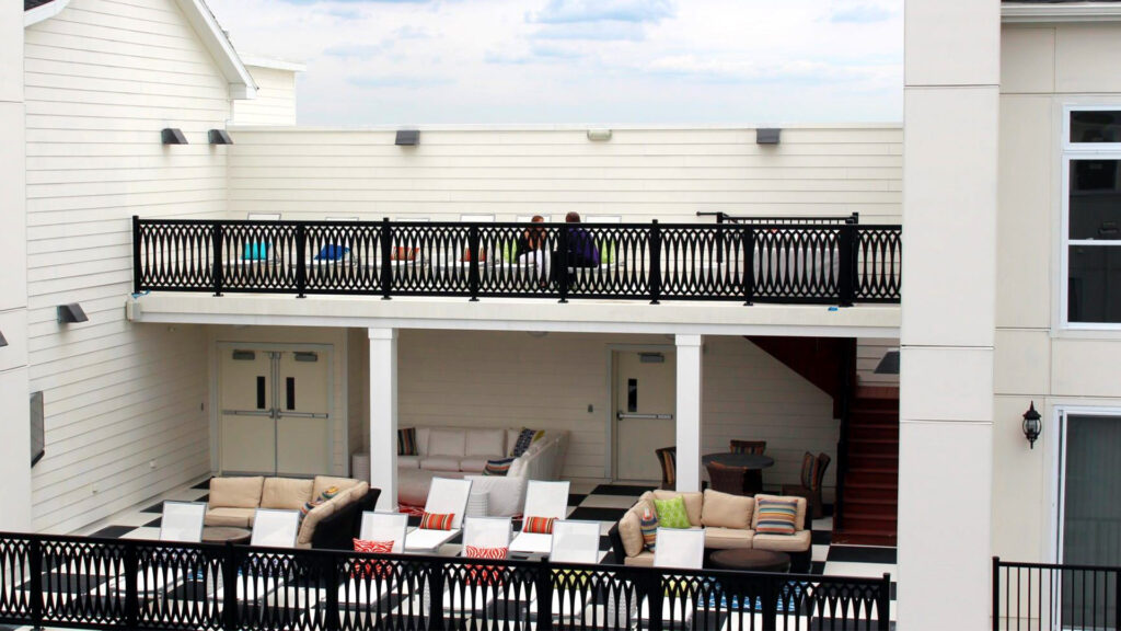 Outdoor area in multifamily space, showcasing a custom infill.