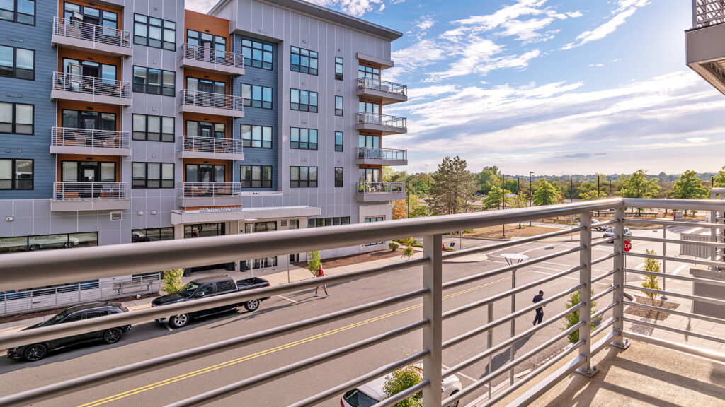 Balcony space on multifamily project, showcasing horizontal picket infill.