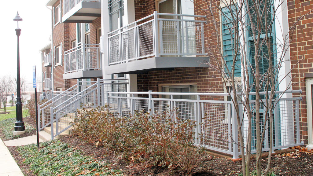 Balcony space on multifamily project, showcasing mesh infill.
