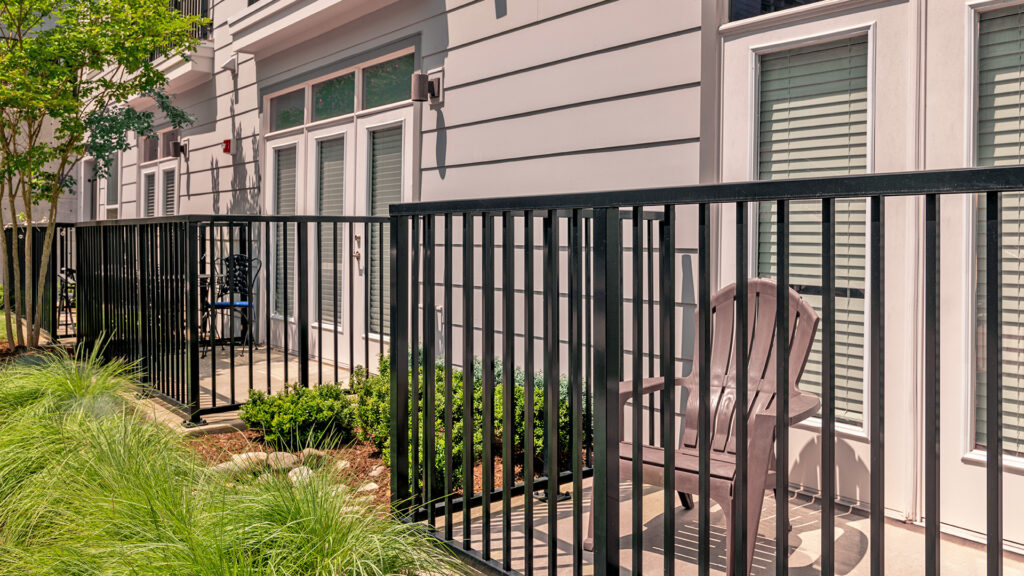 Multifamily outdoor balcony space, showcasing picket infill.