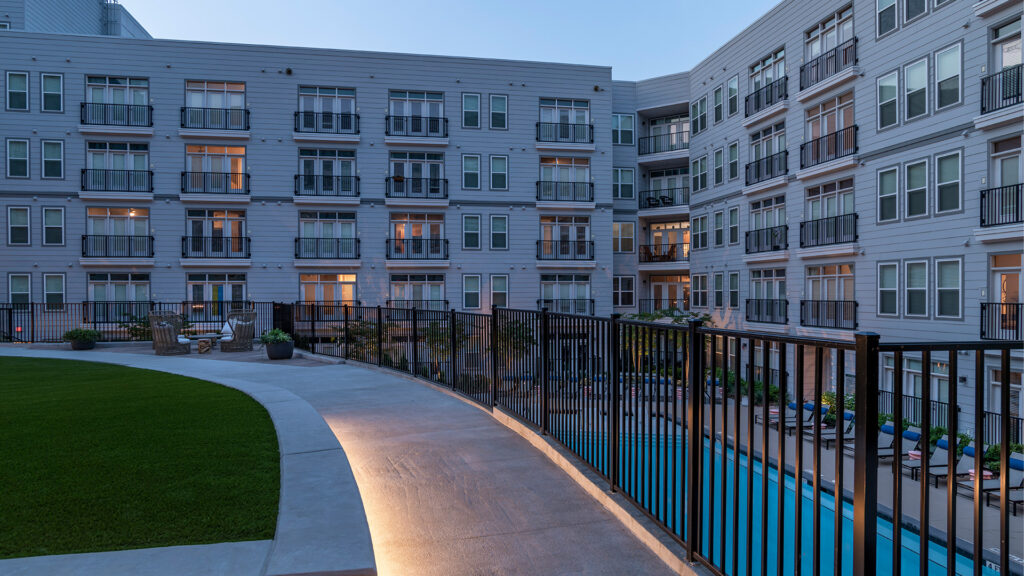 Multifamily space with custom aluminum fence.